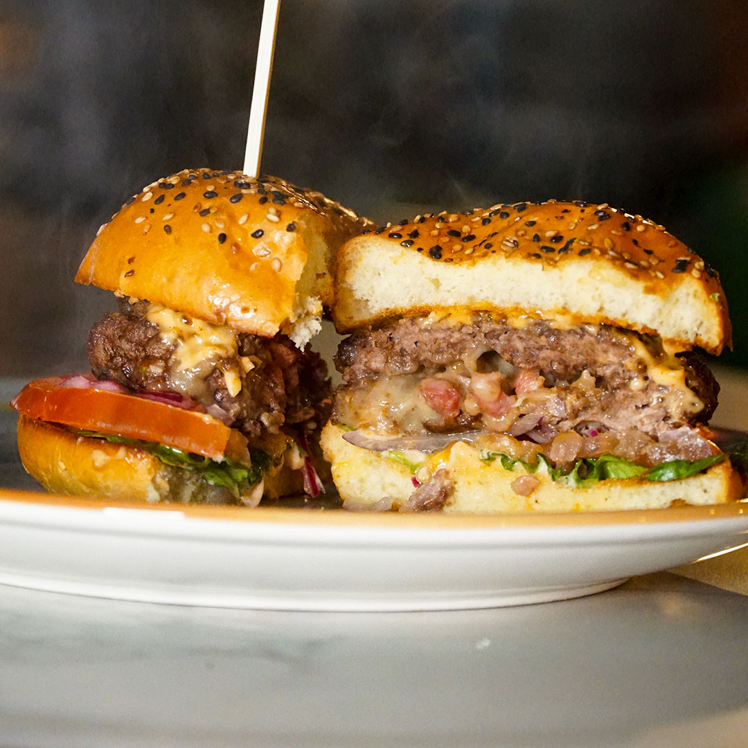 Graphic promoting the midweek burger and pint deal at The Old Quarter: any burger and any pint for €20, available Tuesday to Thursday in Limerick.