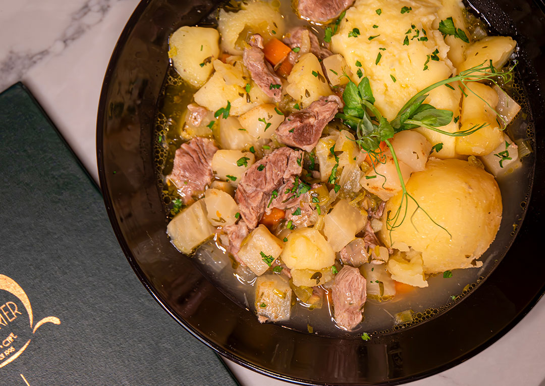 Graphic promoting March Special dish at The Old Quarter, Traditional Irish Lamb Stew. A comforting classic packed with rich flavour and perfect for the season.