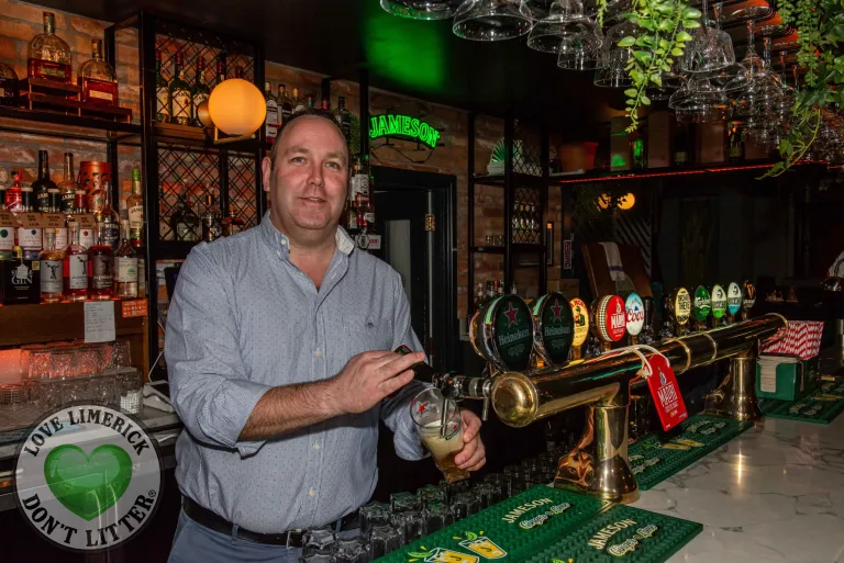 Owner of the Old Quarter Bar JJ Mulcahy poruing a pint in the Cocktail Bar in Limerick