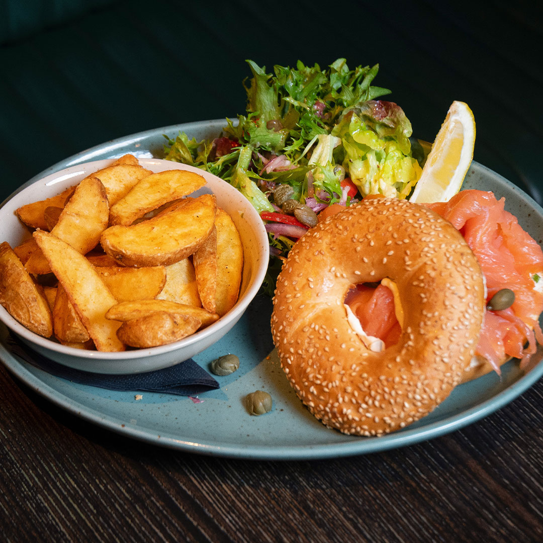 Good Friday Special dish: Cream Cheese & Smoked Salmon Bagel, served with Side Salad and Potato Wedges. Only available on Good Friday at The Old Quarter.